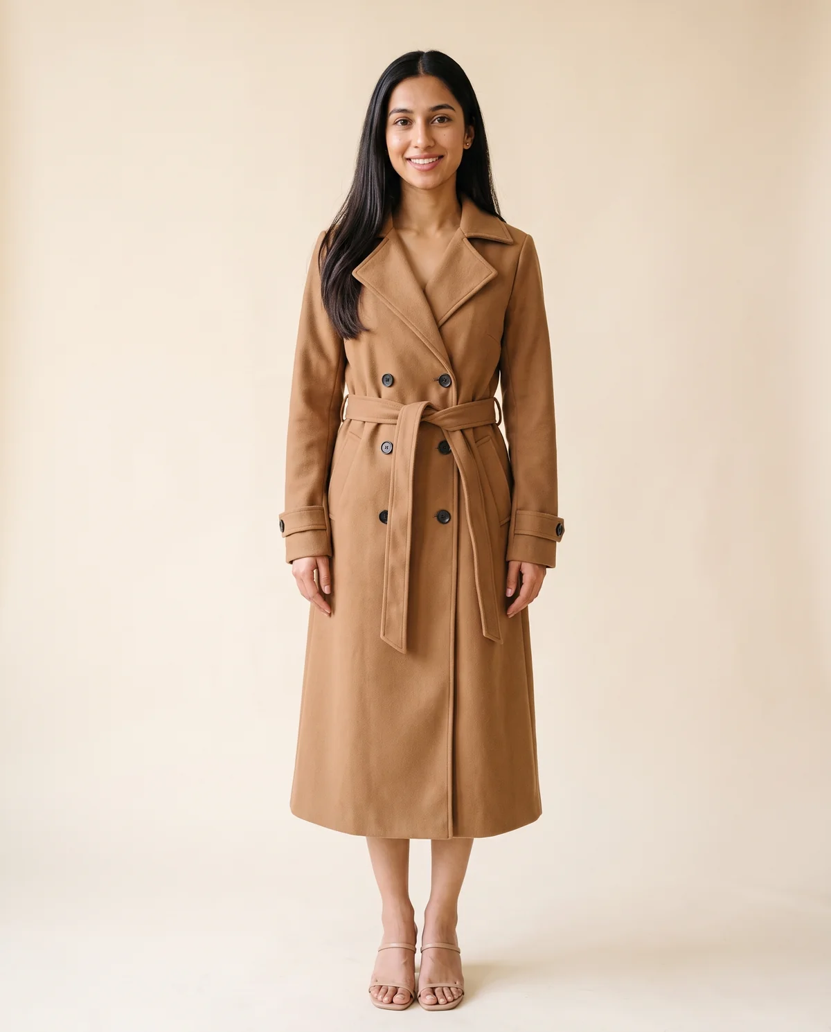 Long Belted Double-Breasted Trench in Camel, front view, worn by Priya
