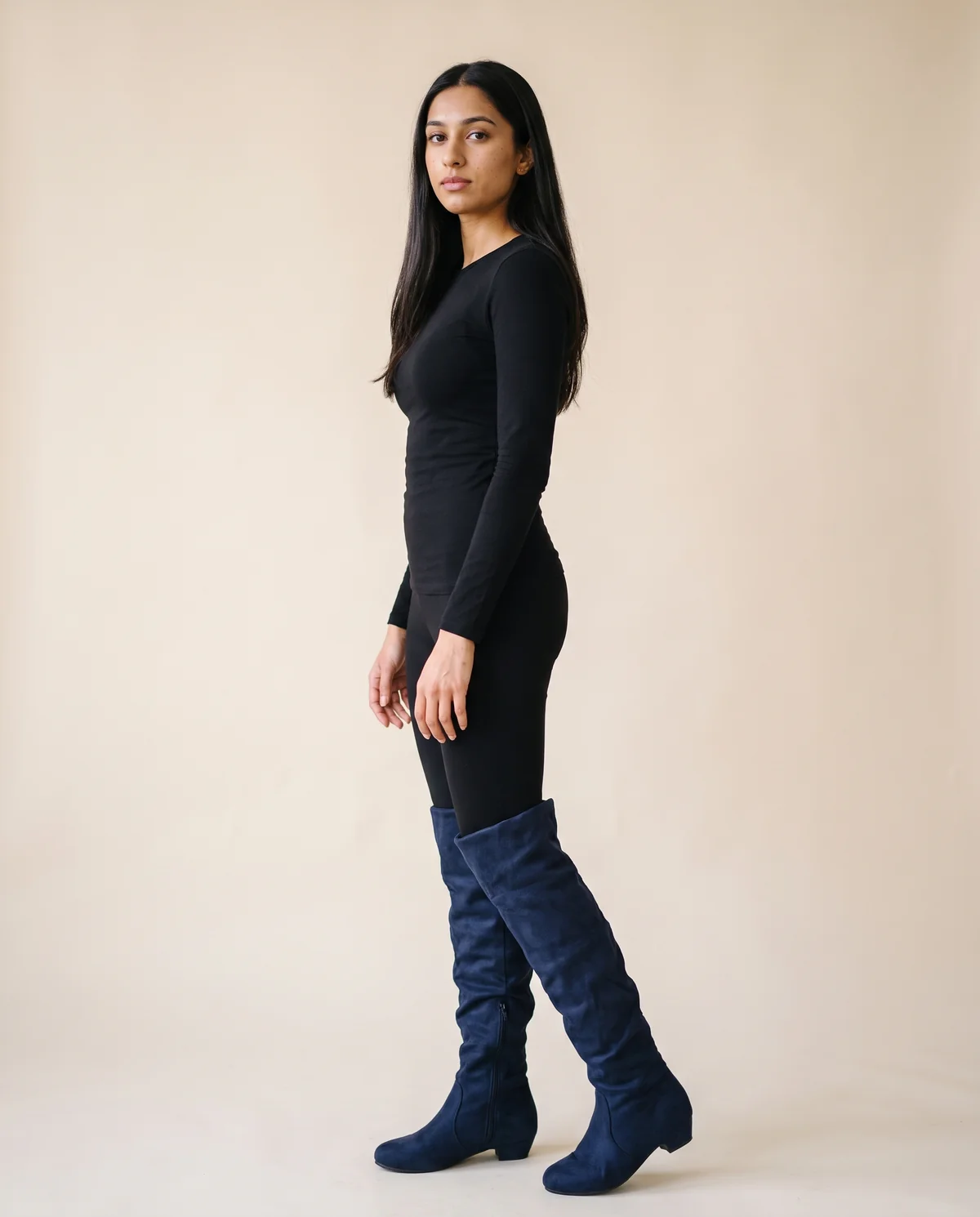 Faux Suede Slouch Boot in Navy, side view, worn by Priya