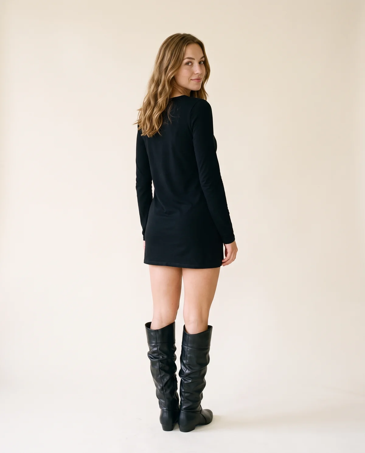 Ruched Slouch Knee-High Boot in Black, back view, worn by Ava
