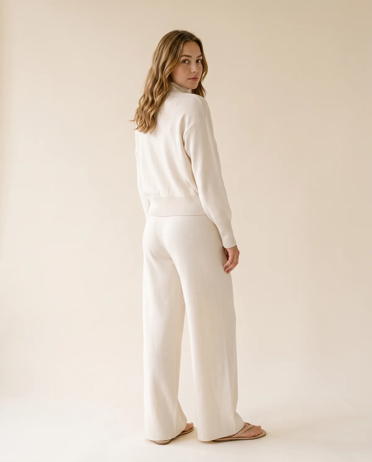 Cream Zip Cardigan and Wide-Leg Knit Trouser Set in Cream, back view, worn by Ava