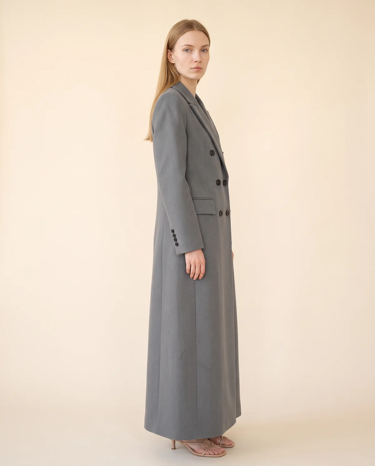 Double-Breasted Maxi Wool-Look Coat with Flap Pockets in Grey, side view, worn by Maya