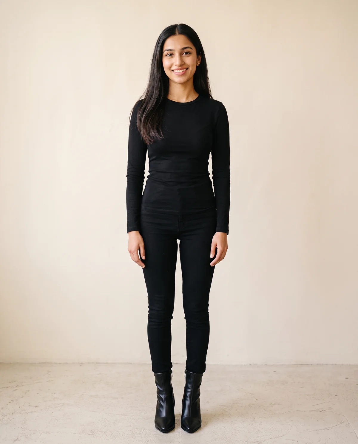 Stretch Pointed Block-Heel Ankle Boot in Black, front view, worn by Priya