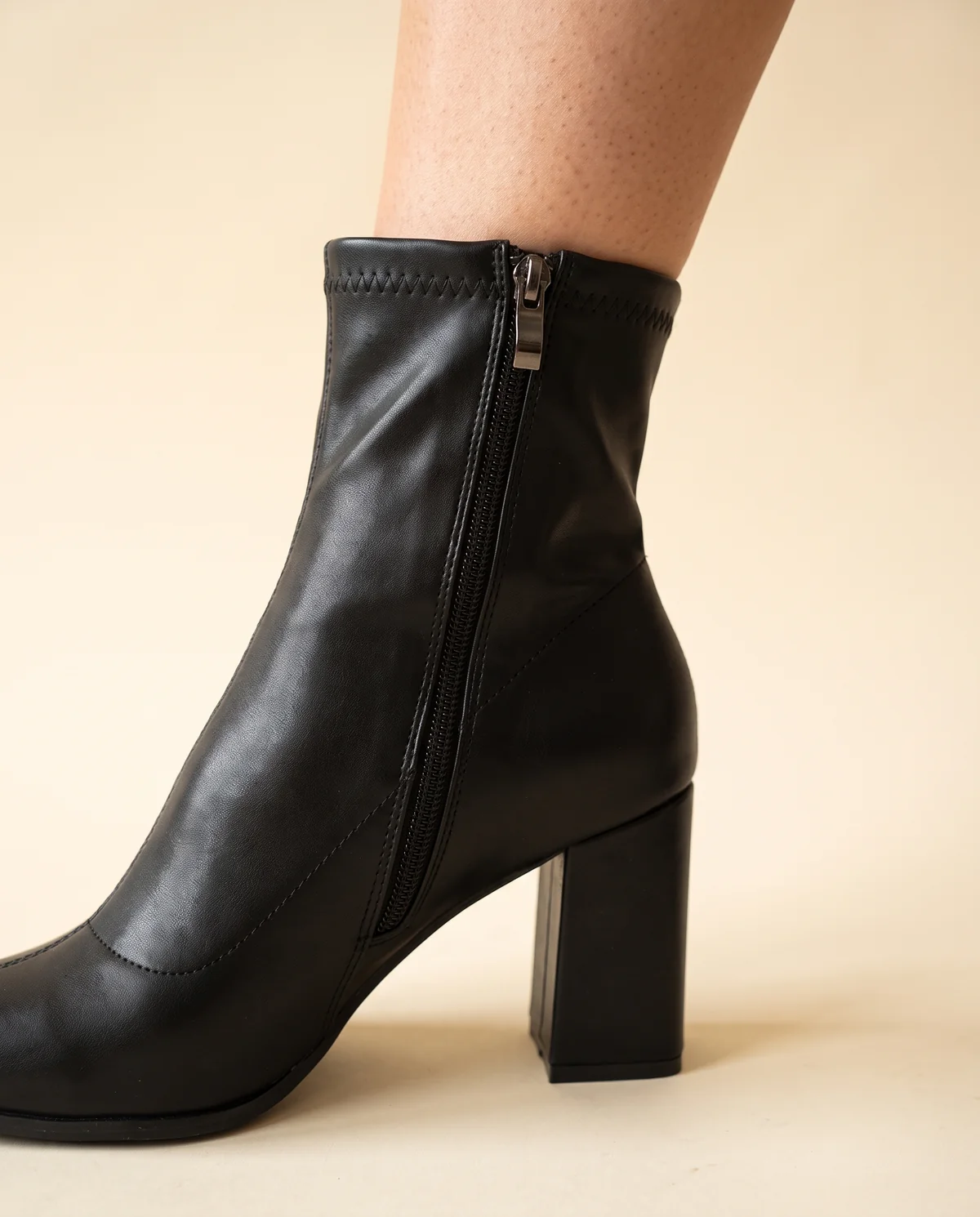 Stretch Pointed Block-Heel Ankle Boot in Black, close-up of the detail