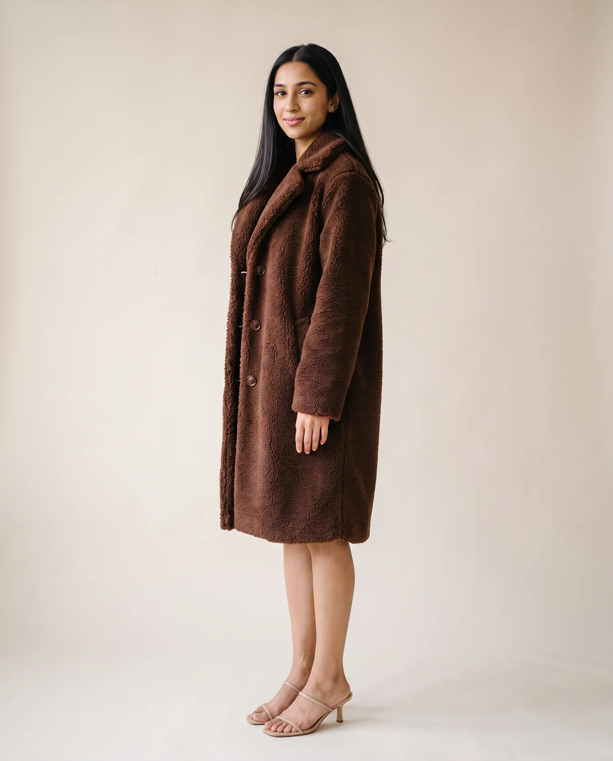 Button-Through Teddy Coat in Chocolate, side view, worn by Priya