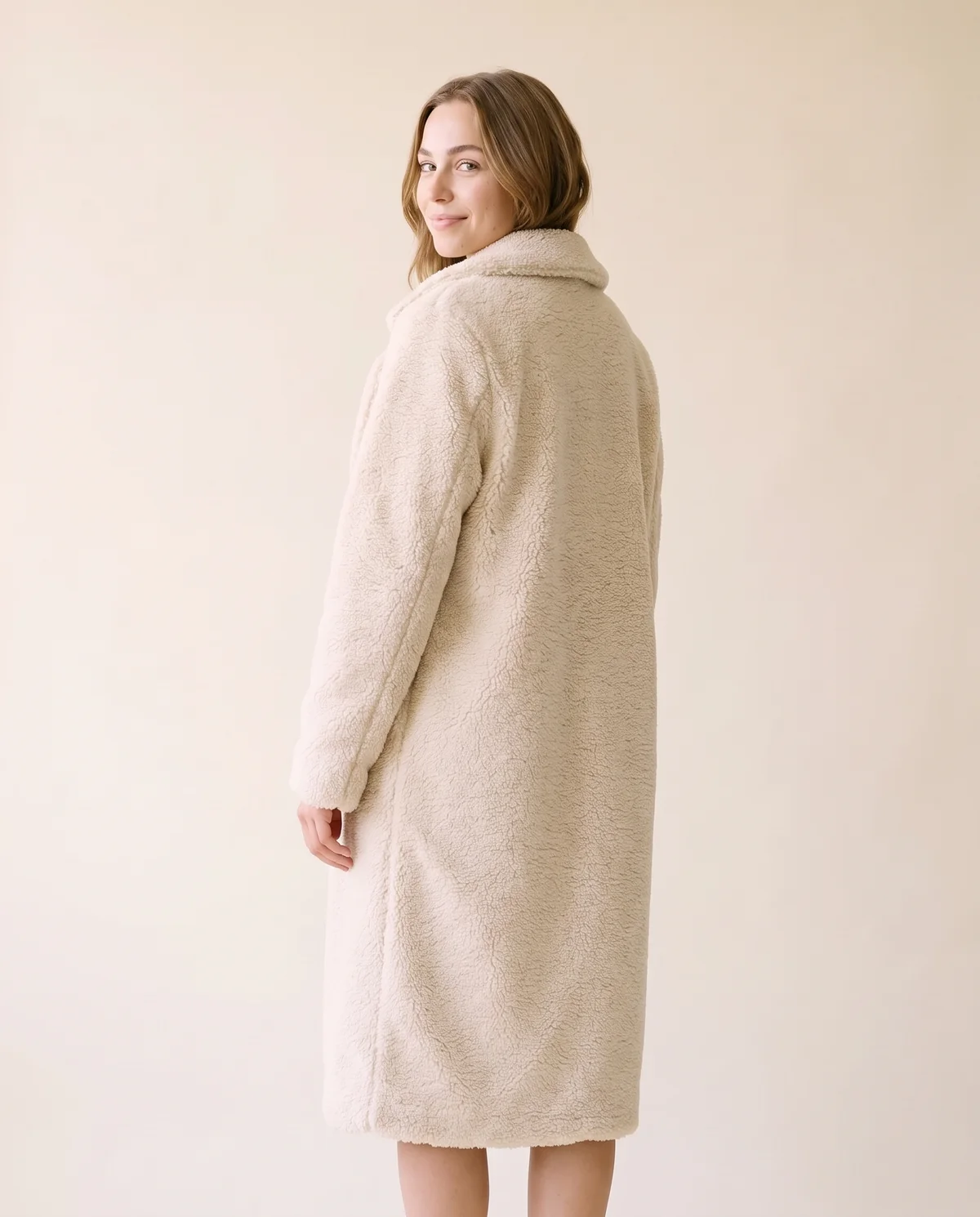 Open-Front Long Teddy Coat in Cream, back view, worn by Ava